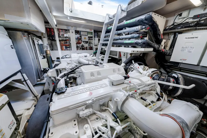 Our Trade Yacht Photos Pics Engine room of a 2017 Prestige 560 yacht, featuring Cummins engines and advanced equipment.