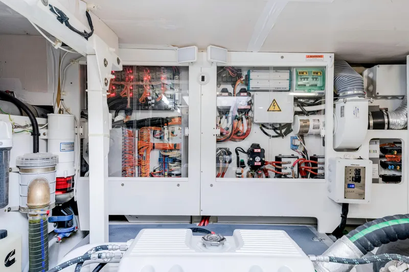 Our Trade Yacht Photos Pics Electrical system inside a 2017 Prestige 560 yacht, showcasing wiring and components.