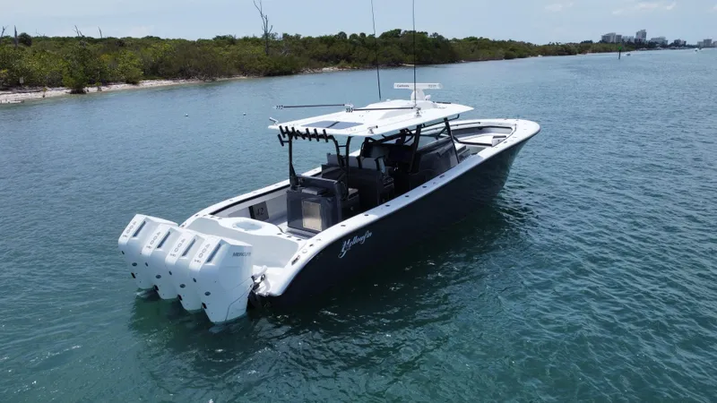  Yacht Photos Pics 2023 Yellowfin 42 boat with four engines on calm water.