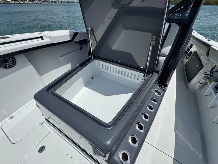  Yacht Photos Pics Open storage compartment on 2023 Yellowfin 42 boat, featuring sleek design and spacious interior.
