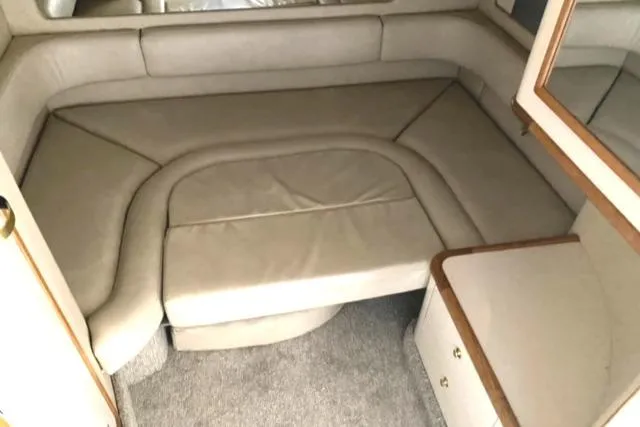 Fresh Water 450 Sundancer Yacht Photos Pics 1997 Sea Ray 450 Sundancer interior cabin with beige seating and carpeted floor.