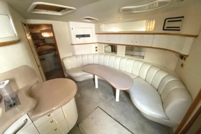 Fresh Water 450 Sundancer Yacht Photos Pics Interior of 1997 Sea Ray 450 Sundancer yacht with curved seating and modern design.