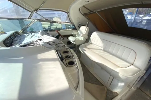 Fresh Water 450 Sundancer Yacht Photos Pics 1997 Sea Ray 450 Sundancer interior with helm, seating, and dashboard.