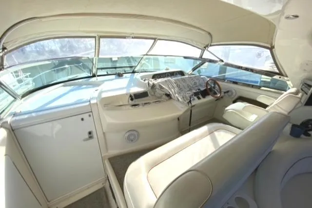 Fresh Water 450 Sundancer Yacht Photos Pics 1997 Sea Ray 450 Sundancer helm with beige interior and panoramic windows.
