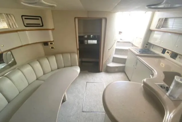 Fresh Water 450 Sundancer Yacht Photos Pics Interior of 1997 Sea Ray 450 Sundancer yacht, featuring a spacious seating area and kitchenette.