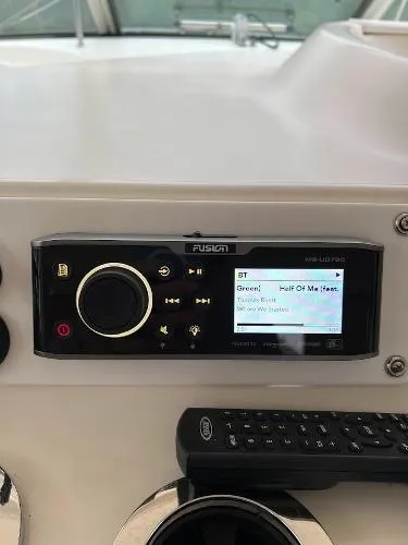 Fresh Water 450 Sundancer Yacht Photos Pics Fusion marine stereo system on a 1997 Sea Ray 450 Sundancer yacht dashboard.