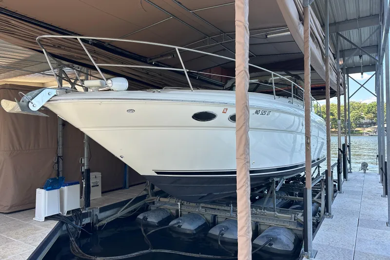  Yacht Photos Pics 2004 Sea Ray 380 Sundancer boat docked in a covered marina slip.