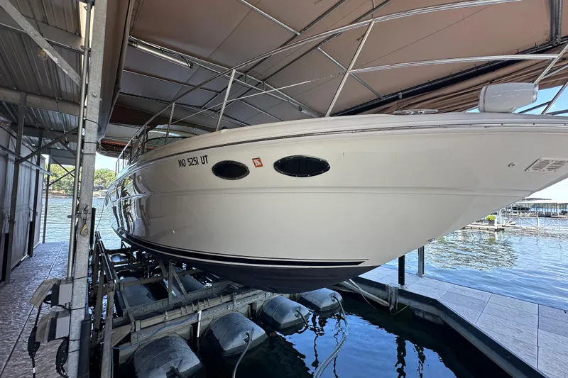  Yacht Photos Pics 2004 Sea Ray 380 Sundancer yacht docked in a covered marina.