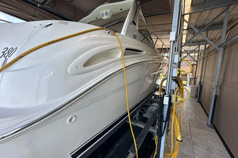  Yacht Photos Pics 2004 Sea Ray 380 Sundancer yacht docked in a covered marina.