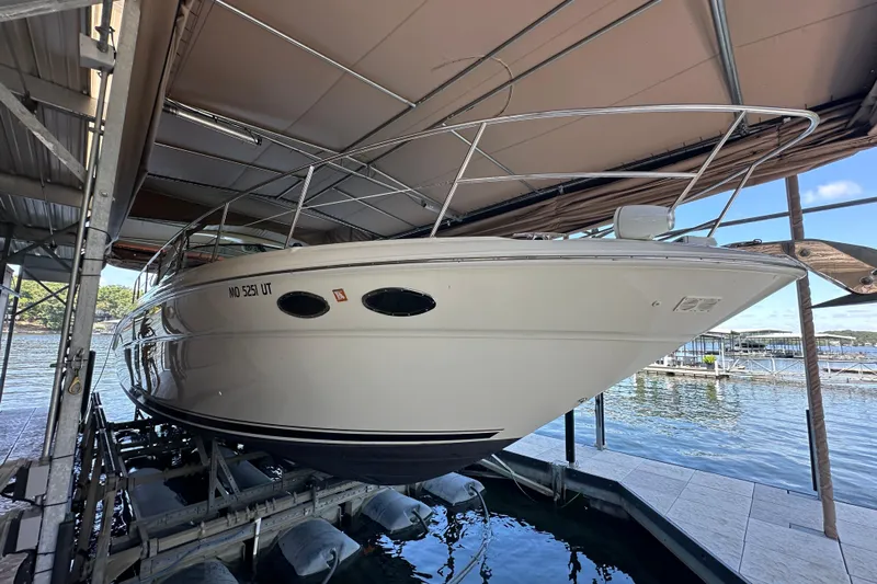  Yacht Photos Pics 2004 Sea Ray 380 Sundancer boat docked in a covered marina.