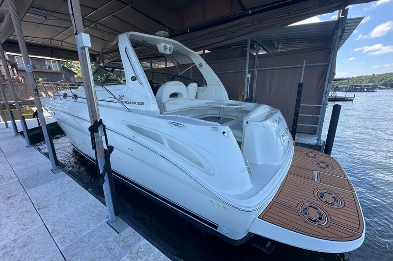  Yacht Photos Pics 2004 Sea Ray 380 Sundancer docked in a covered marina, rear view.