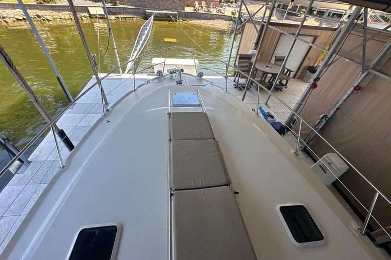  Yacht Photos Pics 2004 Sea Ray 380 Sundancer yacht docked, showcasing spacious deck and seating area.