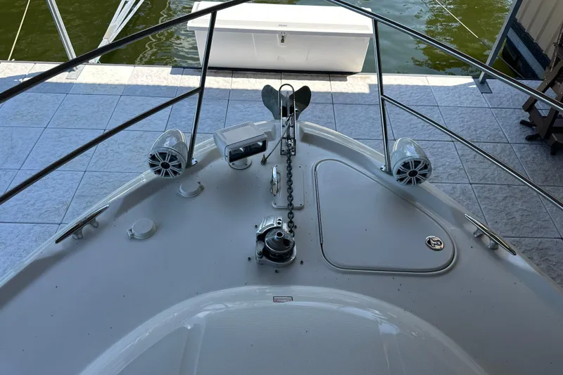  Yacht Photos Pics Bow of 2004 Sea Ray 380 Sundancer with anchor and speakers, docked by water.