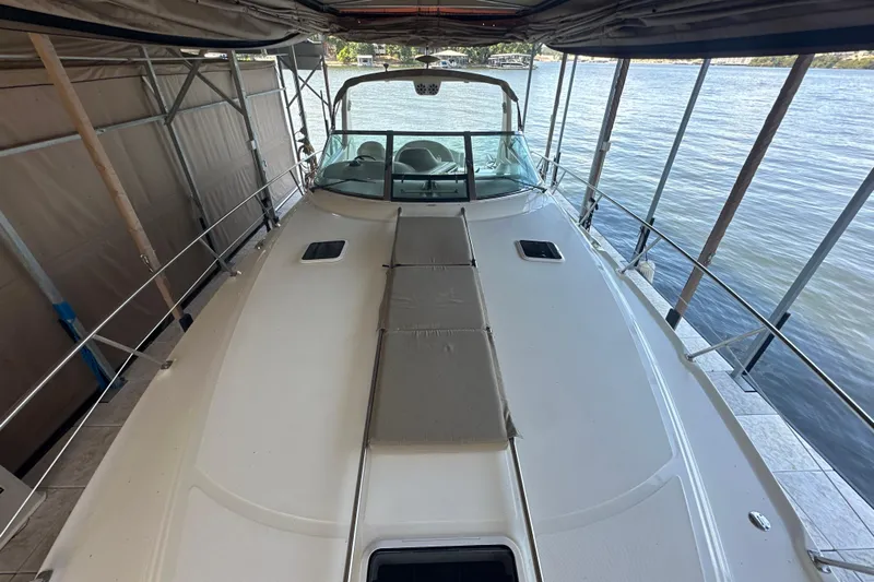  Yacht Photos Pics 2004 Sea Ray 380 Sundancer yacht docked, showcasing spacious deck and sleek design.