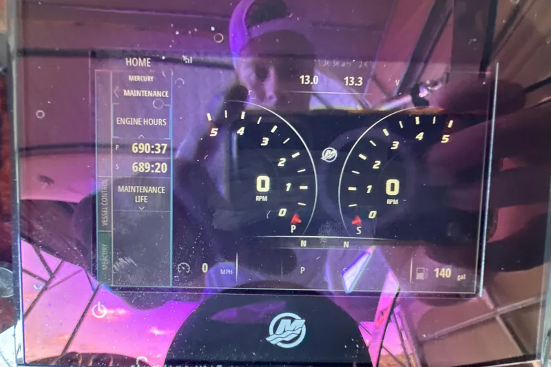  Yacht Photos Pics Dashboard of a 2004 Sea Ray 380 Sundancer showing engine hours and RPM gauges.