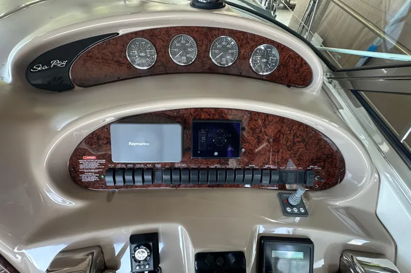  Yacht Photos Pics Control panel of a 2004 Sea Ray 380 Sundancer boat with gauges and switches.