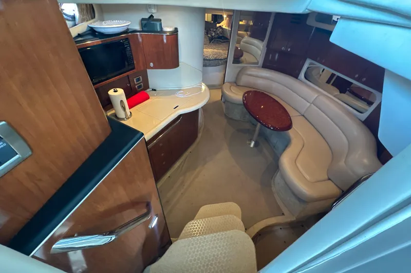  Yacht Photos Pics Interior of 2004 Sea Ray 380 Sundancer yacht with kitchen and seating area.