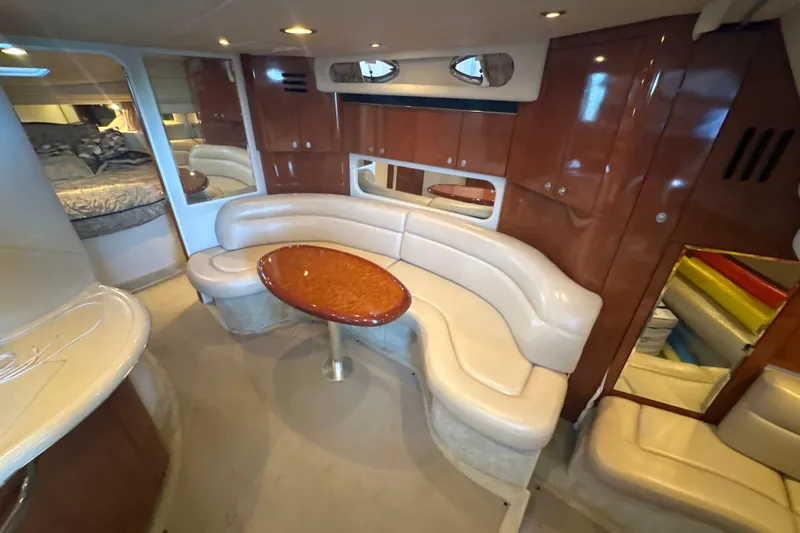  Yacht Photos Pics Luxurious 2004 Sea Ray 380 Sundancer interior with elegant seating and wood accents.