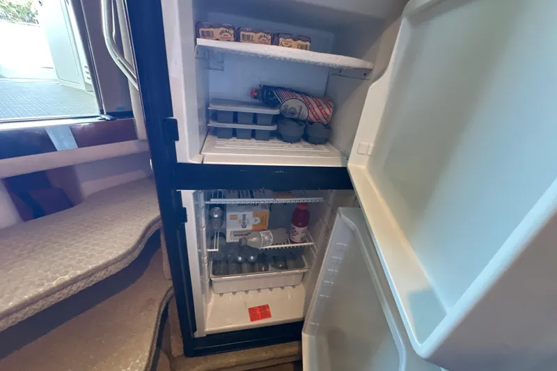  Yacht Photos Pics Open refrigerator inside 2004 Sea Ray 380 Sundancer yacht, stocked with drinks and food.
