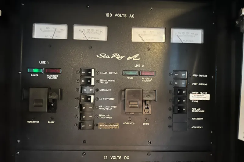  Yacht Photos Pics Electrical control panel of a 2004 Sea Ray 380 Sundancer boat, showing switches and meters.