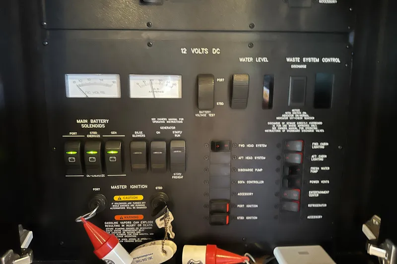  Yacht Photos Pics Control panel of a 2004 Sea Ray 380 Sundancer boat, featuring various switches and gauges.