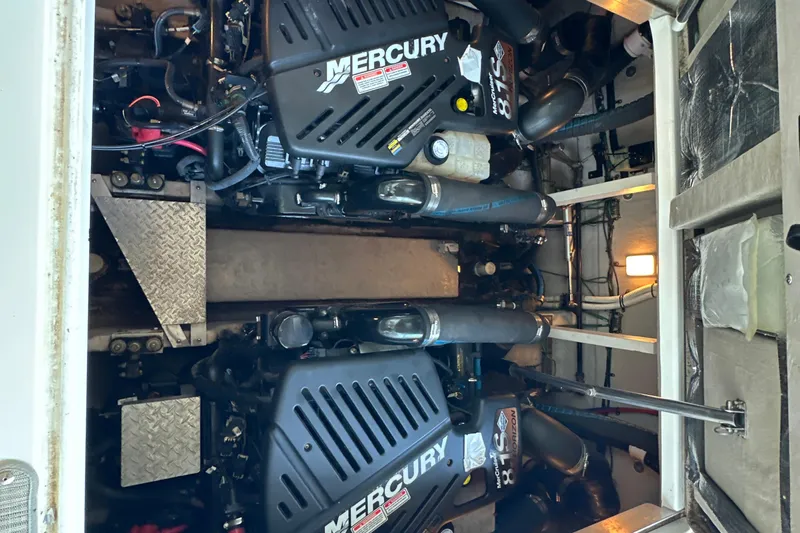  Yacht Photos Pics Engine compartment of 2004 Sea Ray 380 Sundancer with twin Mercury engines.