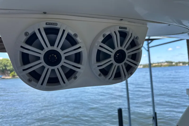  Yacht Photos Pics Kicker speakers on a 2004 Sea Ray 380 Sundancer, overlooking a serene lake.