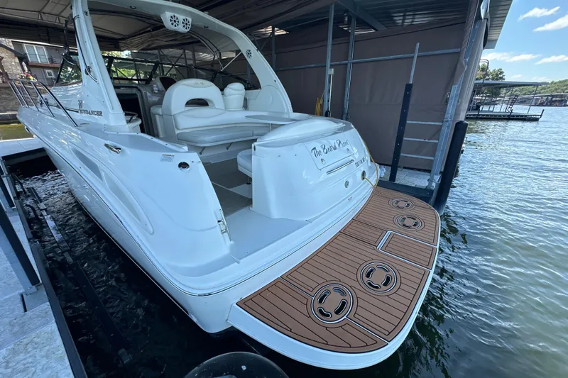  Yacht Photos Pics 2004 Sea Ray 380 Sundancer docked, featuring spacious deck and elegant design.