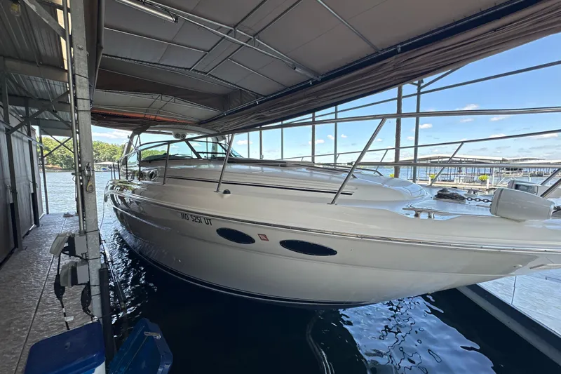  Yacht Photos Pics 2004 Sea Ray 380 Sundancer docked in a covered marina, side view.