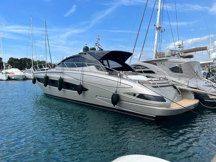  Yacht Photos Pics Luxury 2010 Riva Vertigo 63 yacht docked in a marina.