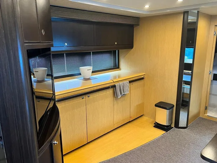  Yacht Photos Pics Luxurious interior of 2010 Riva Vertigo 63 yacht with modern cabinetry and sleek design.