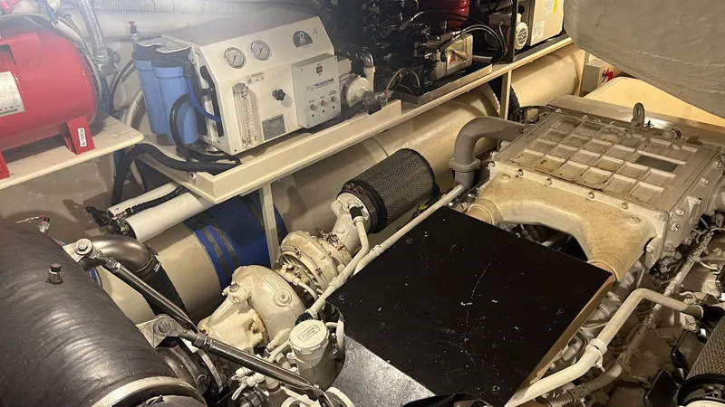  Yacht Photos Pics Engine room of a 2010 Riva Vertigo 63 yacht, showcasing mechanical components and equipment.