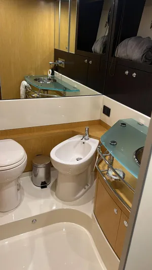  Yacht Photos Pics Luxurious bathroom in 2010 Riva Vertigo 63 yacht with modern fixtures and elegant design.