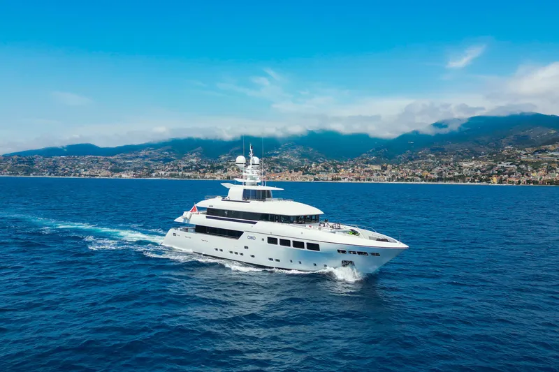 Okko Yacht Photos Pics Luxurious 2013 Mondomarine 41M yacht cruising on blue ocean near scenic coastline.