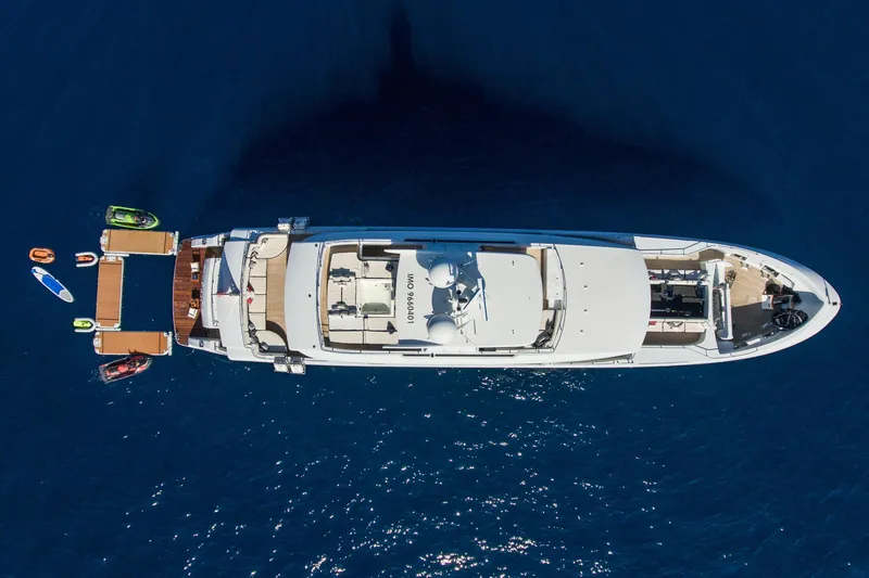 Okko Yacht Photos Pics Aerial view of 2013 Mondomarine 41M yacht with watercrafts in blue ocean.