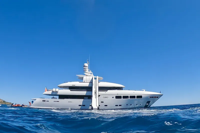 Okko Yacht Photos Pics Luxurious 2013 Mondomarine 41M yacht cruising on open sea under clear blue sky.