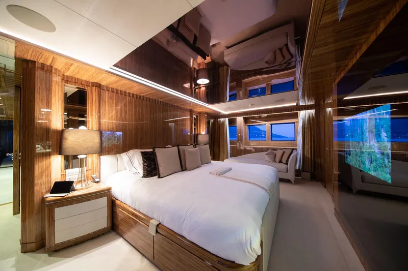 Okko Yacht Photos Pics Luxurious Mondomarine 41M 2013 yacht bedroom with elegant wood paneling and modern decor.
