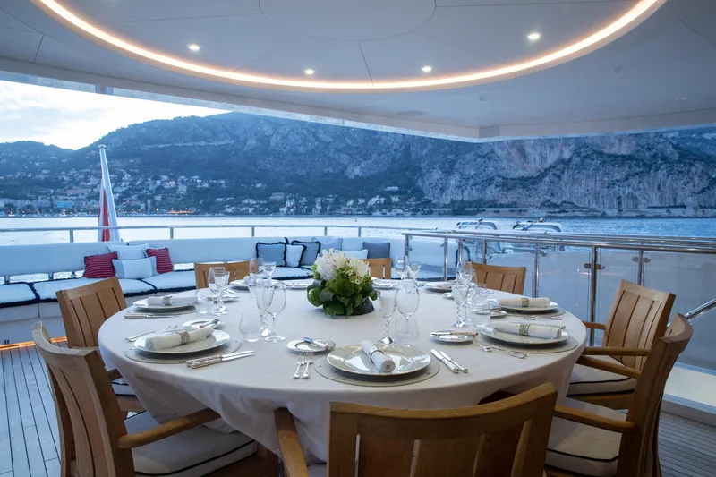 Okko Yacht Photos Pics Luxurious dining setup on 2013 Mondomarine 41M yacht with scenic ocean view.