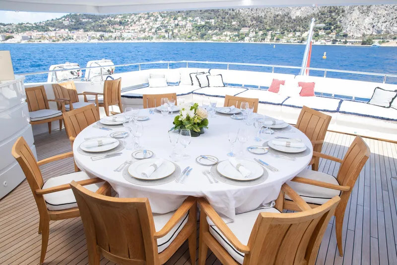 Okko Yacht Photos Pics Luxurious dining setup on 2013 Mondomarine 41M yacht with ocean view.