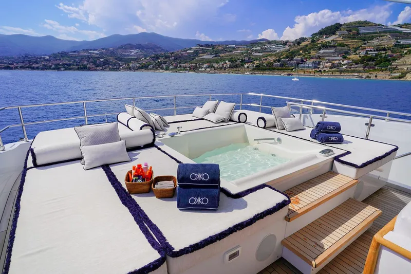 Okko Yacht Photos Pics Luxurious Mondomarine 41M yacht deck with jacuzzi, cushions, and ocean view, 2013 model.
