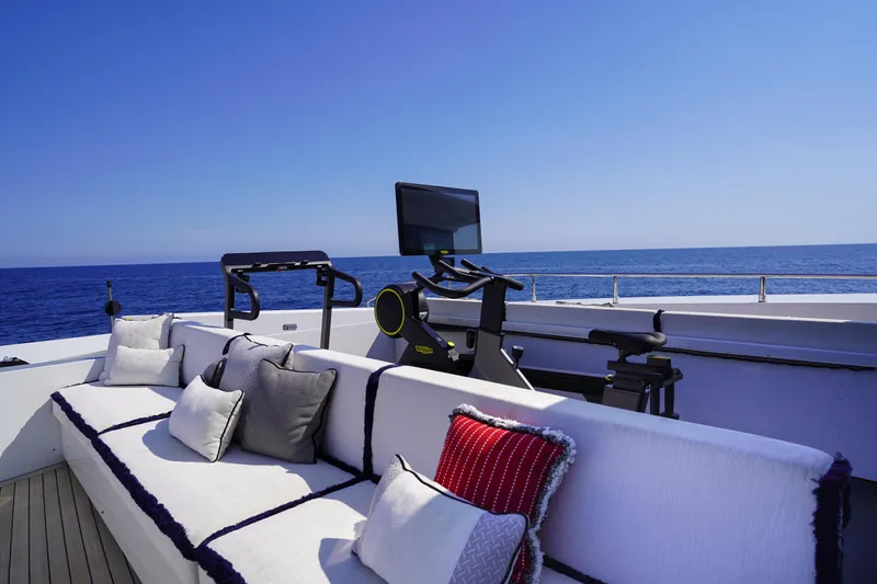 Okko Yacht Photos Pics Luxurious Mondomarine 41M yacht deck with exercise equipment and ocean view, 2013 model.