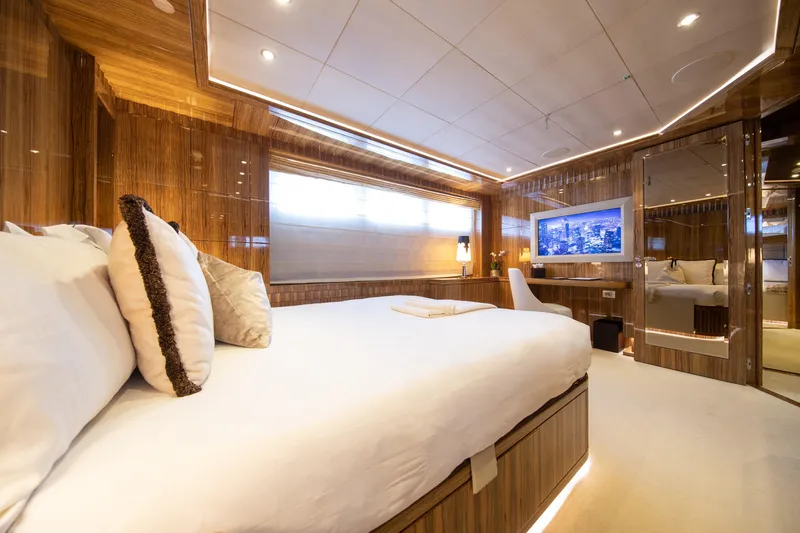 Okko Yacht Photos Pics Luxurious Mondomarine 41M yacht bedroom interior, 2013 model, featuring elegant wood paneling and modern amenities.