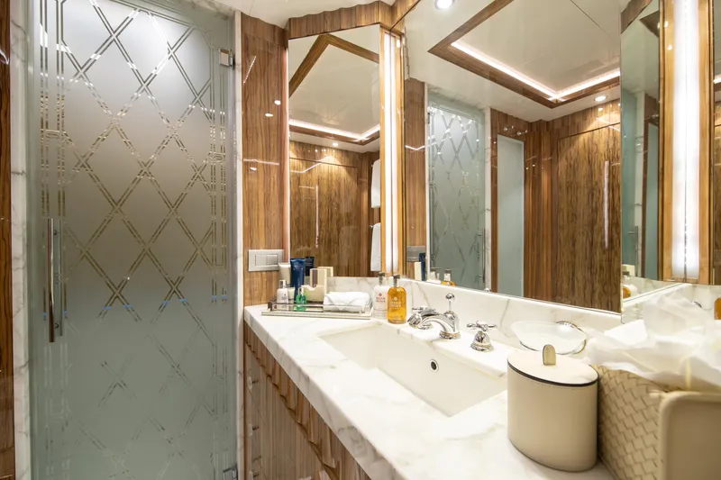 Okko Yacht Photos Pics Luxurious Mondomarine 41M 2013 yacht bathroom with elegant wood accents and modern fixtures.