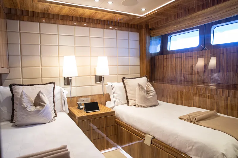 Okko Yacht Photos Pics Luxurious Mondomarine 41M 2013 yacht cabin with twin beds and elegant wood paneling.