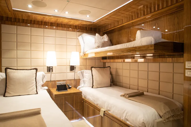 Okko Yacht Photos Pics Luxurious Mondomarine 41M 2013 yacht cabin with elegant twin beds and warm lighting.