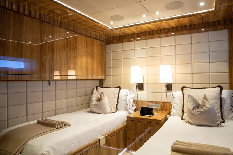 Okko Yacht Photos Pics Luxurious Mondomarine 41M 2013 yacht cabin with twin beds and elegant wood paneling.