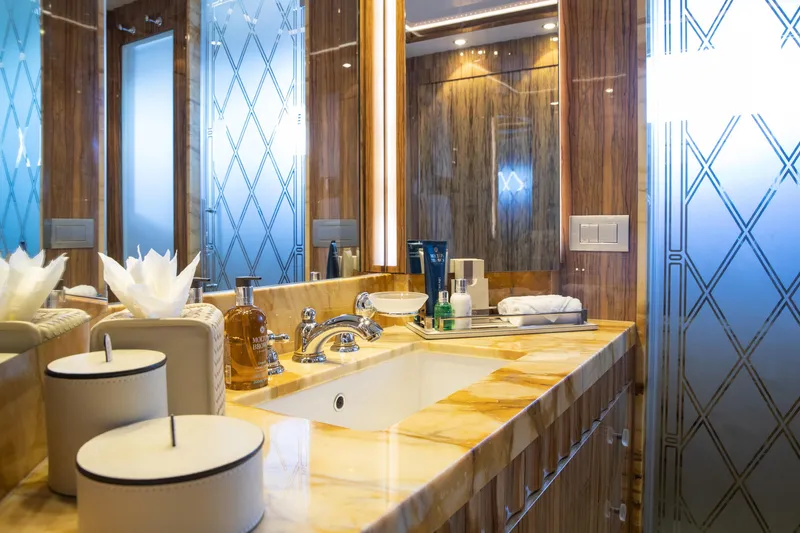 Okko Yacht Photos Pics Luxurious bathroom on 2013 Mondomarine 41M yacht with elegant marble and modern fixtures.