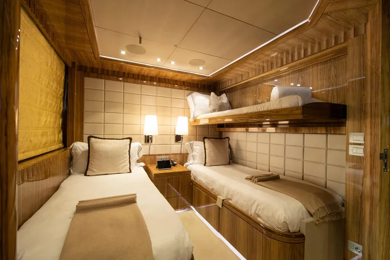 Okko Yacht Photos Pics Luxurious Mondomarine 41M yacht cabin interior, 2013 model, featuring elegant wood paneling and cozy beds.