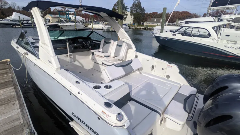  Yacht Photos Pics 2020 Chaparral 280 OSX boat docked, featuring spacious seating and dual engines.