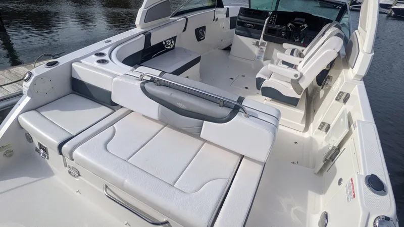  Yacht Photos Pics 2020 Chaparral 280 OSX boat interior with white seating and modern dashboard.